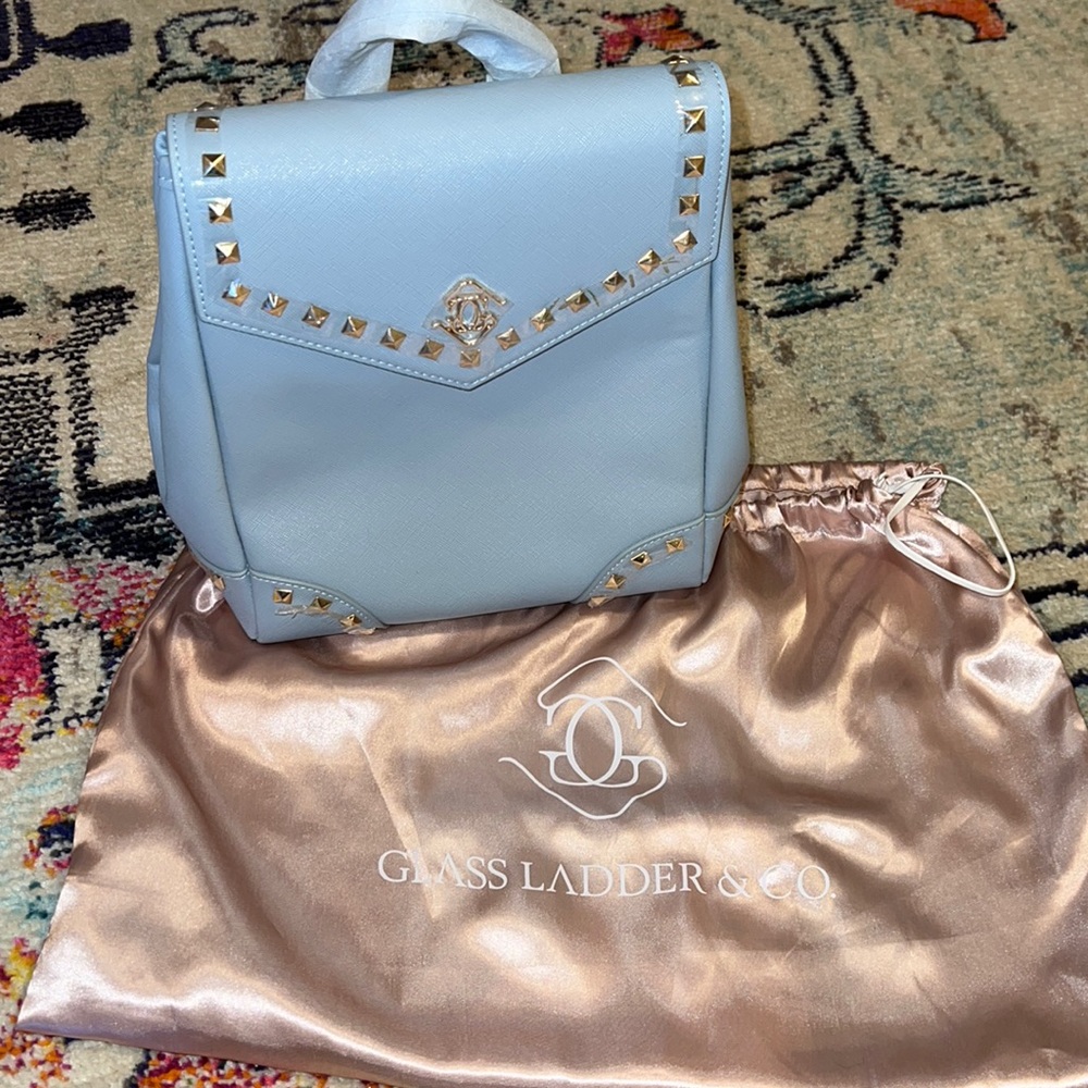 Glass Ladder @ Co light blue backpack with crossbody strap